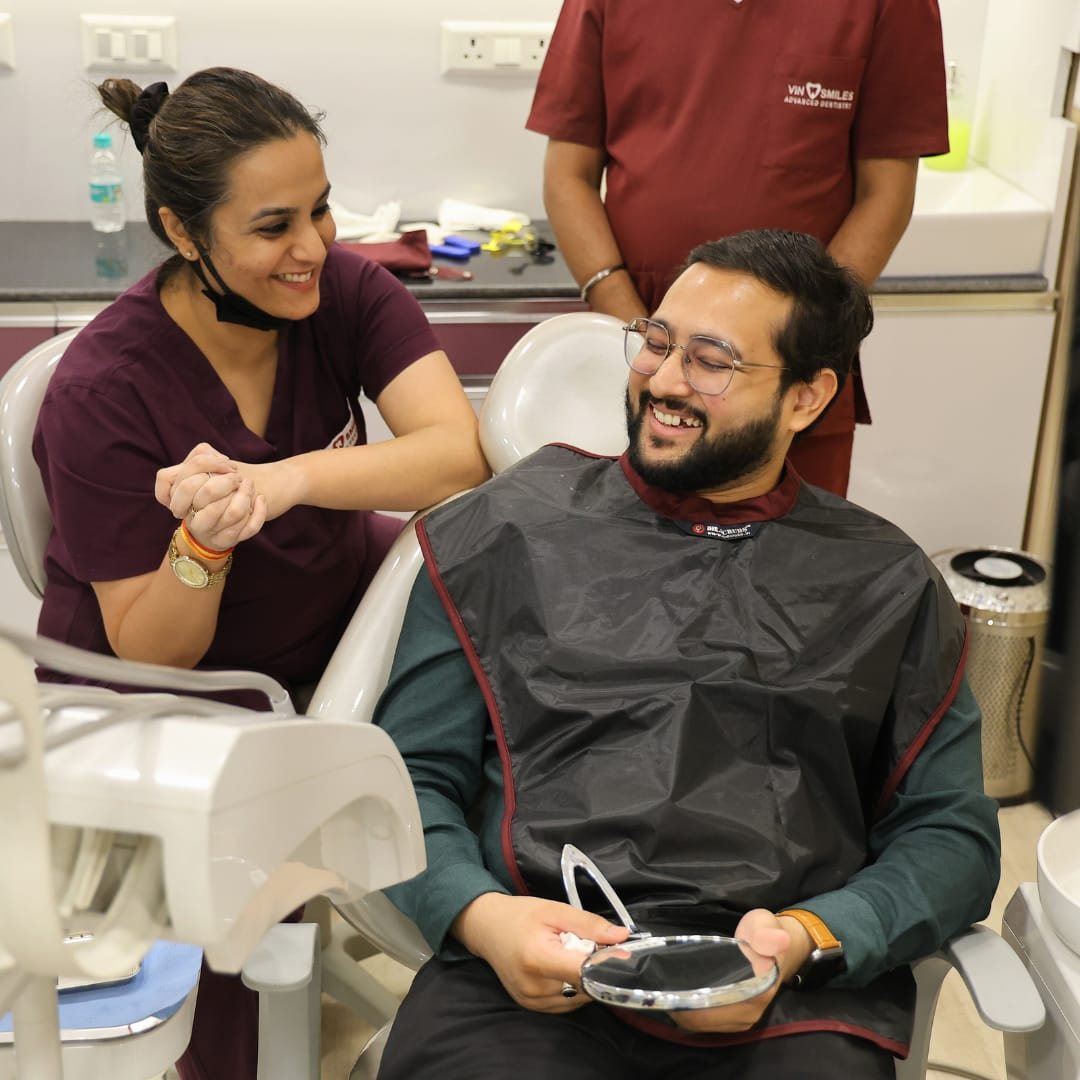 A patient seeing his new teeth for the first time