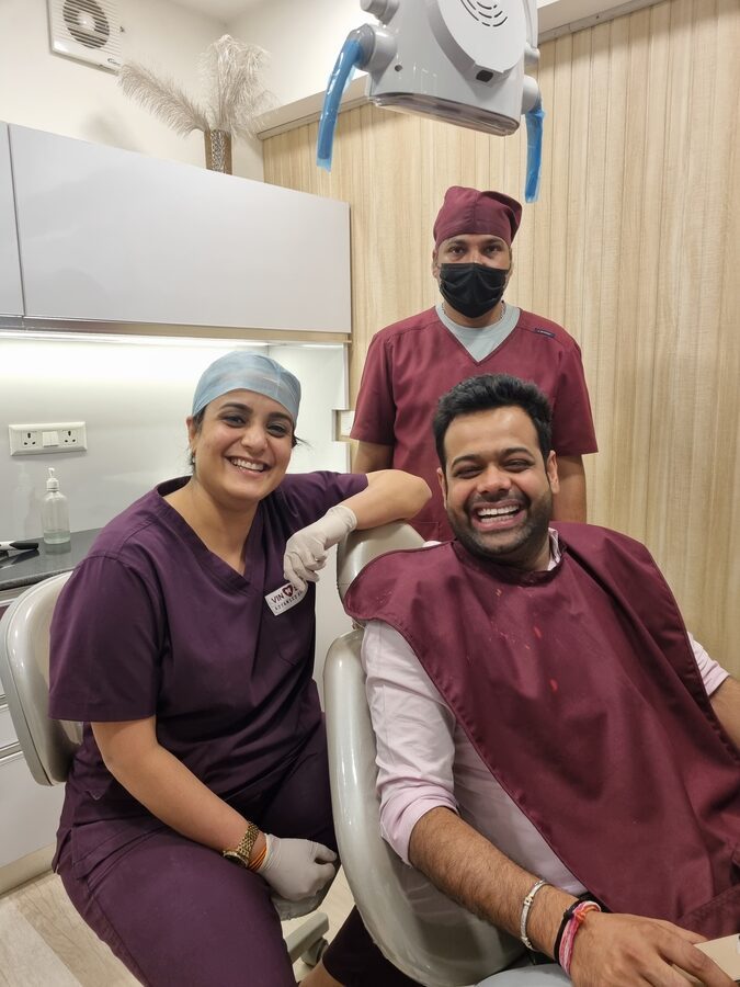 Our prosthodontist with a rehabilitation patient